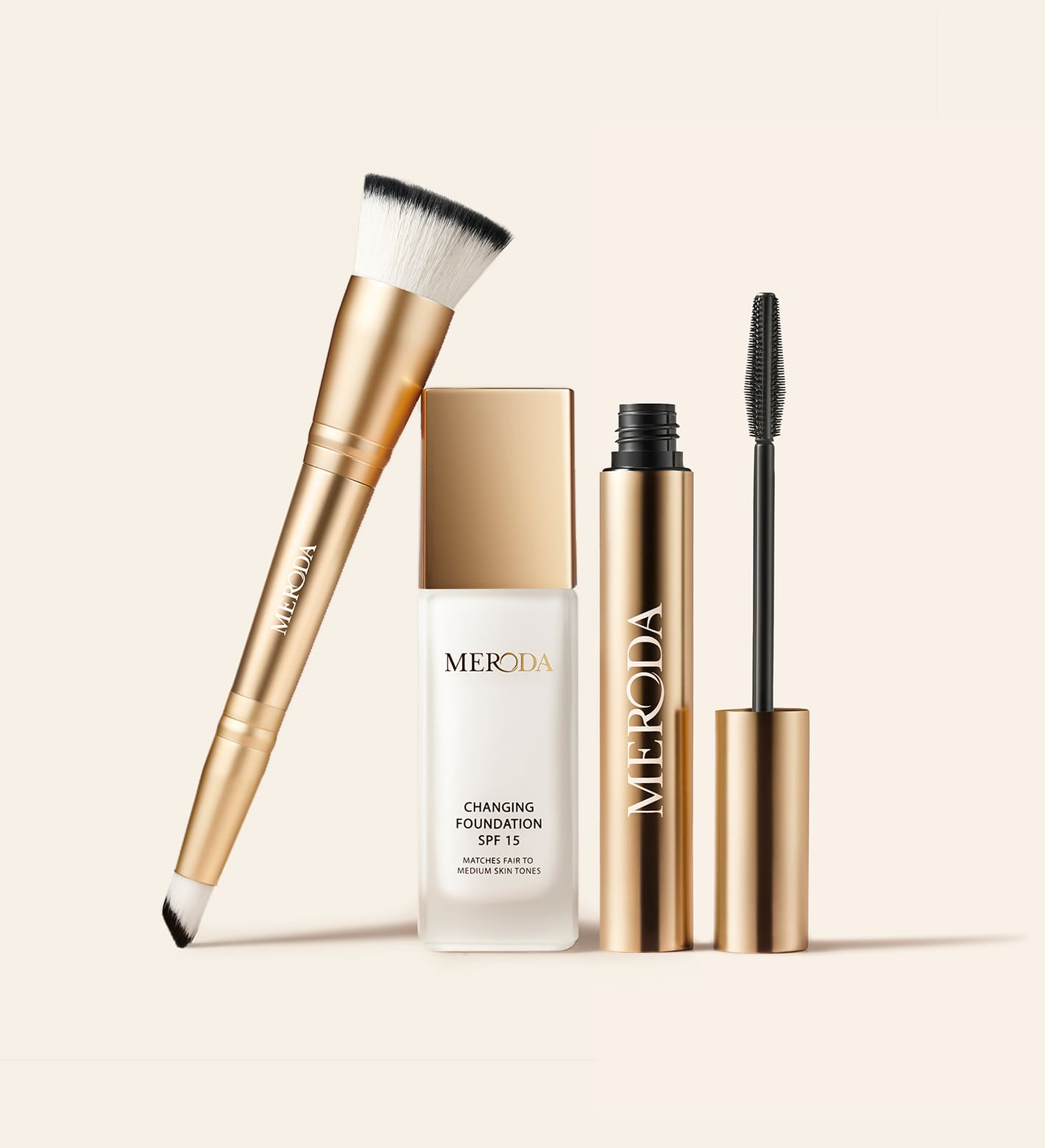 The Meroda Starter Set met gouden Changing Foundation, Gilded Lashes Mascara en 2-in-1 Build & Conceal Brush.
