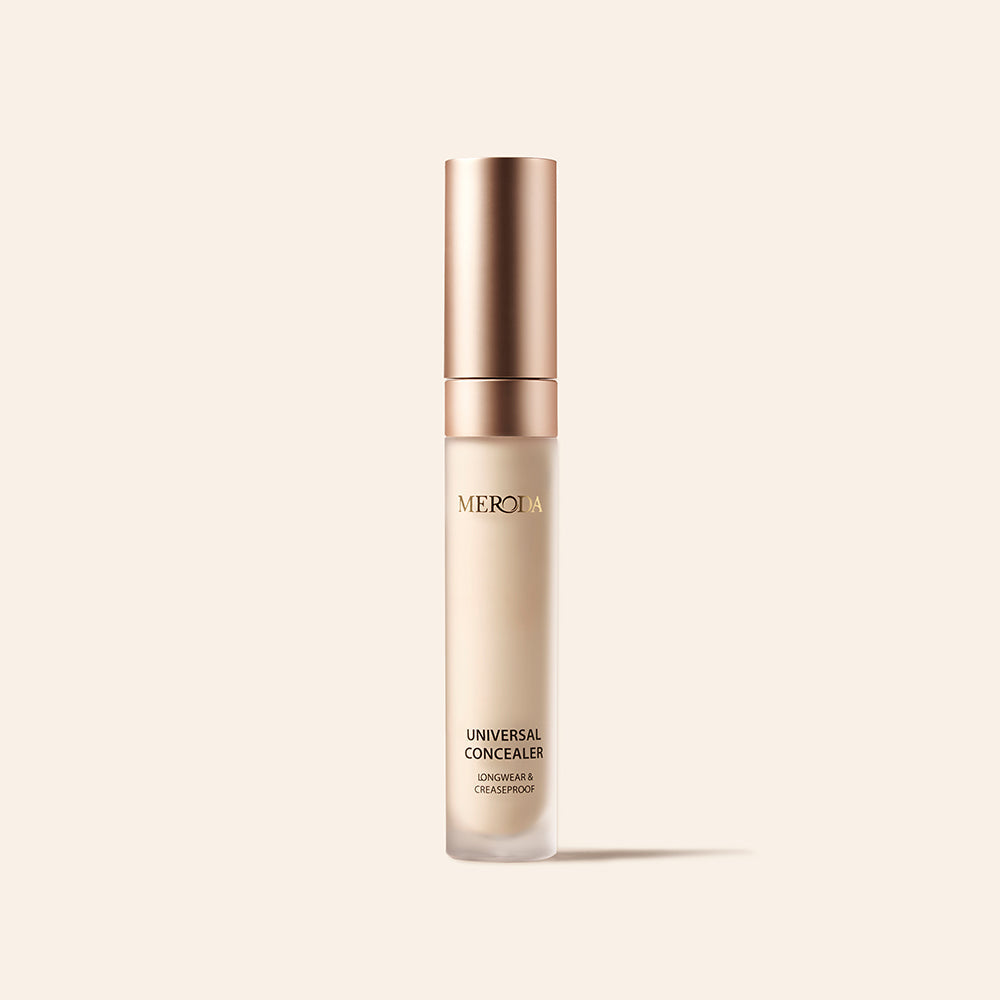 Universal Concealer tube met roségouden dop en longwear, creaseproof voordelen op een neutrale achtergrond.