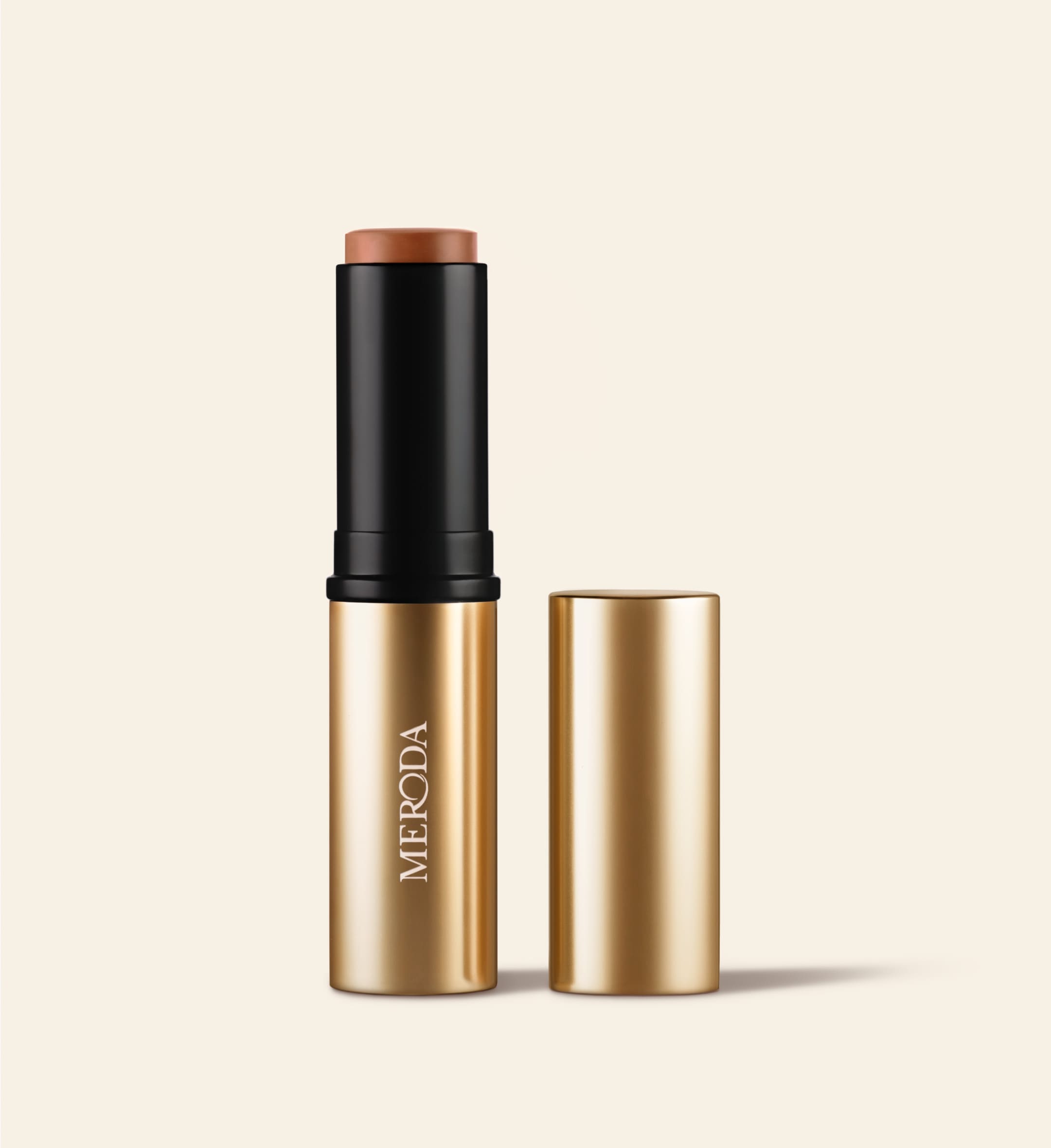 Soft Tan Bronzer in de kleur Dark rechtop staand met de gouden dop ernaast geplaatst.